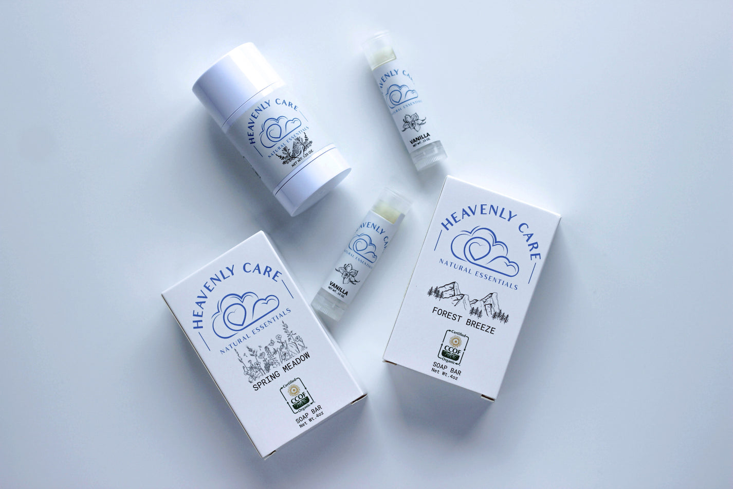 Heavenly Skincare Bundle on a white surface, featuring organic soaps, deodorant, and lip balms made with natural ingredients.